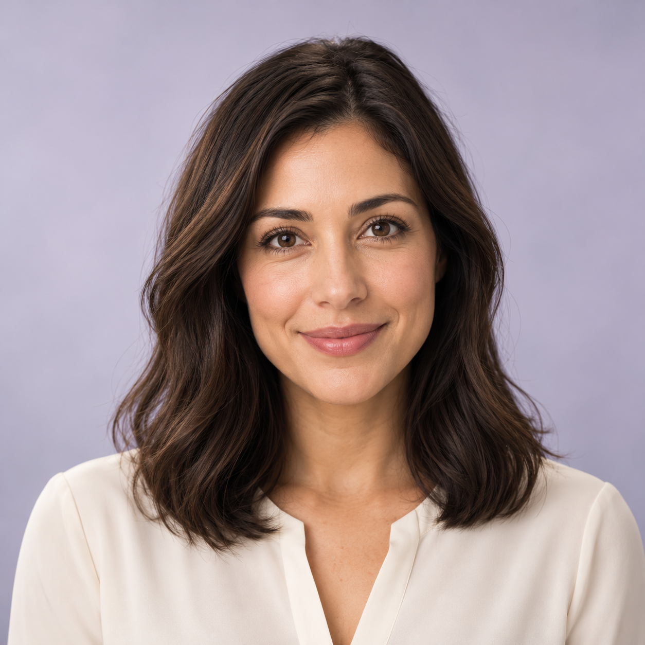 Welcoming female HUME avatar with dark brown hair in a reception kiosk